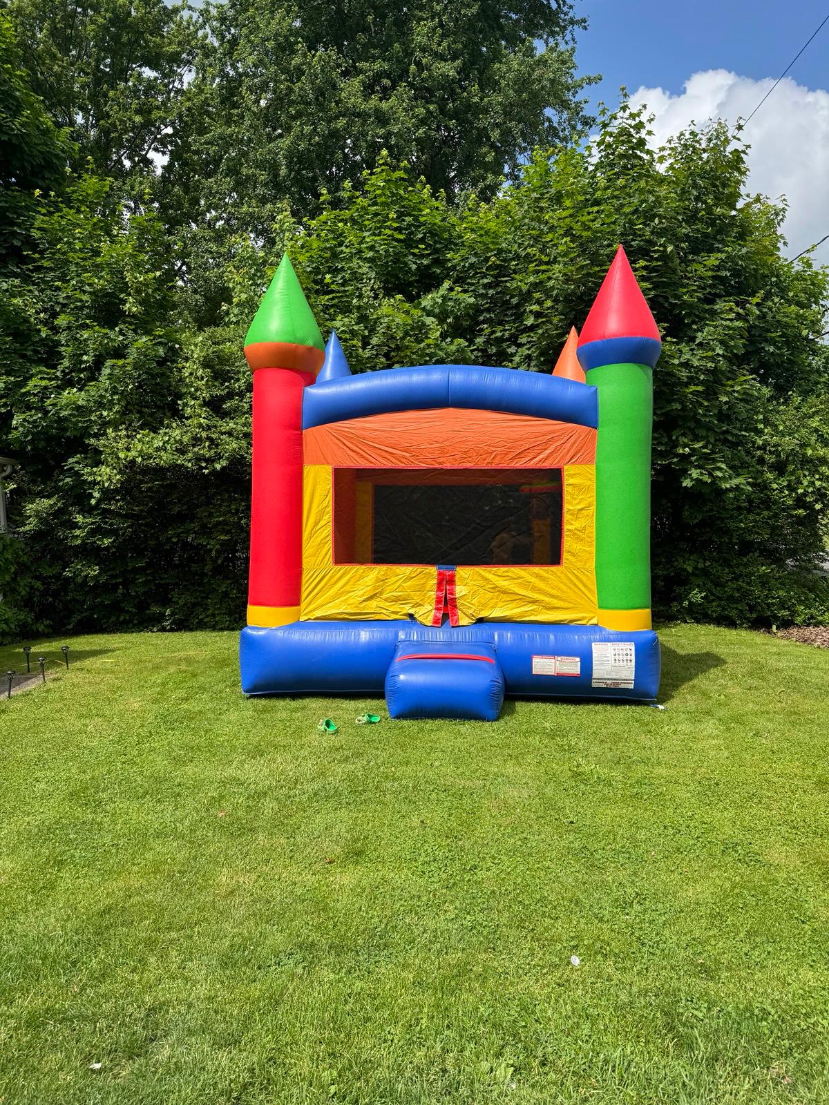 Classic bounce house rental set up outdoors on grass